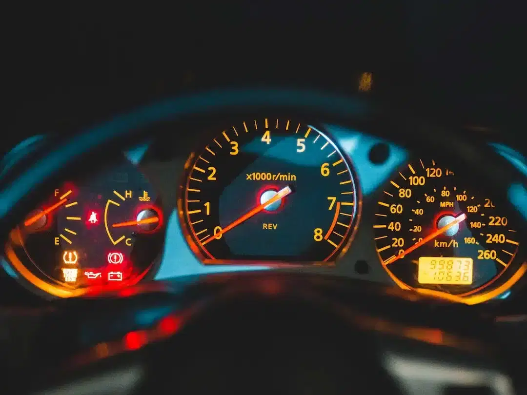 Car dashboard with multiple warning lights indicating potential vehicle issues for lemon law claim