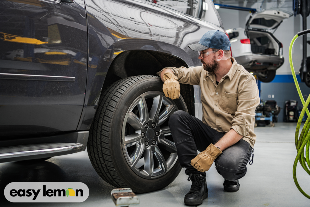 Pickup truck on a lift during a recall repair, demonstrating ram truck recall lemon law rights when defects persist.