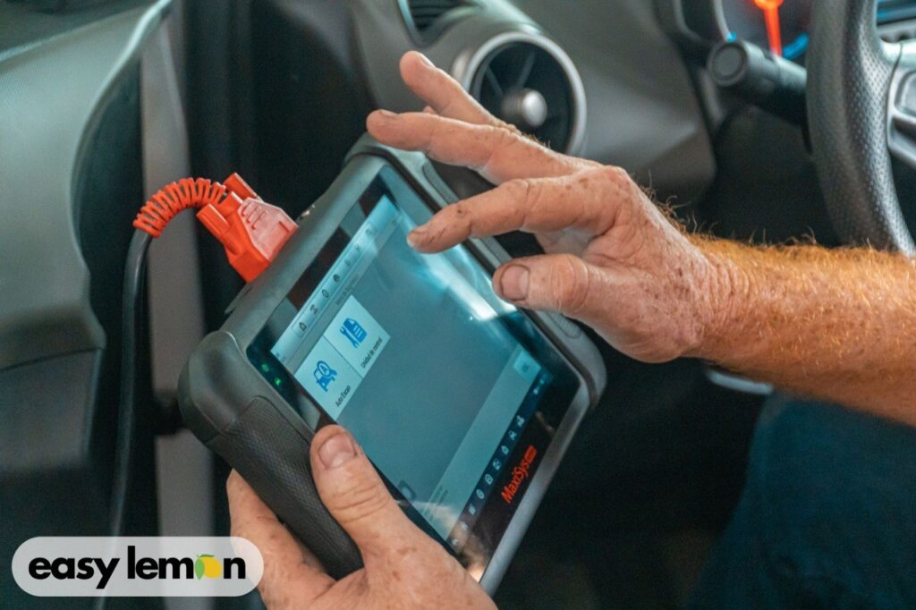 Mechanic scanning fault codes to diagnose common Ranger problems