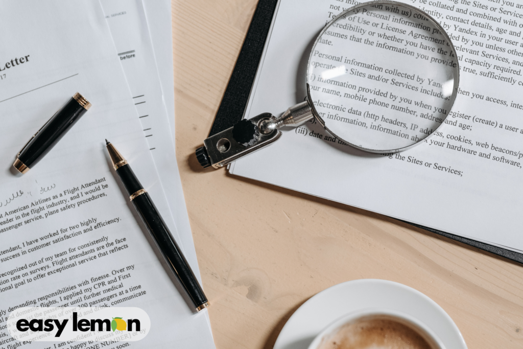 Magnifying glass reviewing legal documents to illustrate hidden rights and protections available to consumers under