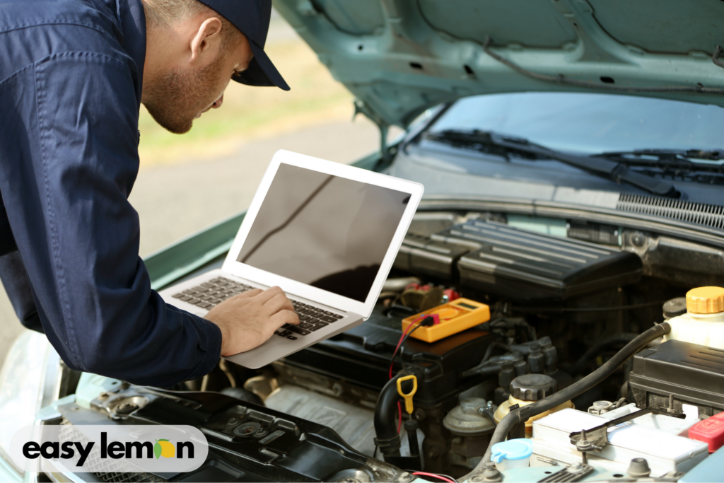 Mechanic inspecting Ram truck for issues related to the Ram electronic stability control recall